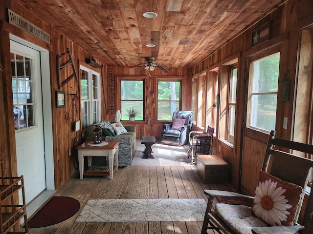 227 Brooks Pond Dr, Corinna, ME 04928 - sunroom with wooden ceiling, wood walls, hardwood / wood-style floors, and a wooden deck