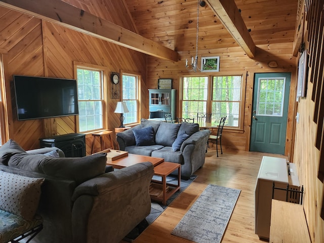 227 Brooks Pond Dr, Corinna, ME 04928 - living room with wooden walls, light wood finished floors, and wooden ceiling
