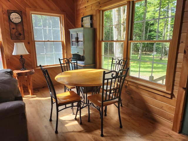 227 Brooks Pond Dr, Corinna, ME 04928 - dining room featuring wooden walls and wood finished floors