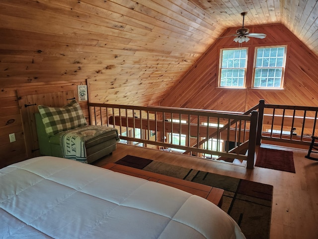 227 Brooks Pond Dr, Corinna, ME 04928 - bedroom featuring wood finished floors, wooden walls, lofted ceiling, and wooden ceiling