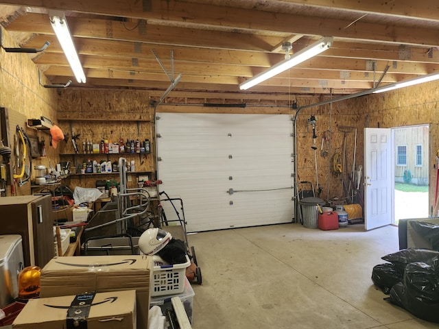 227 Brooks Pond Dr, Corinna, ME 04928 - garage featuring a workshop area