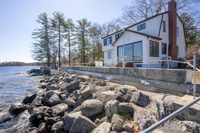 73 Wards Cove Rd, Standish, ME 04084 - view of property exterior featuring a chimney and a water view