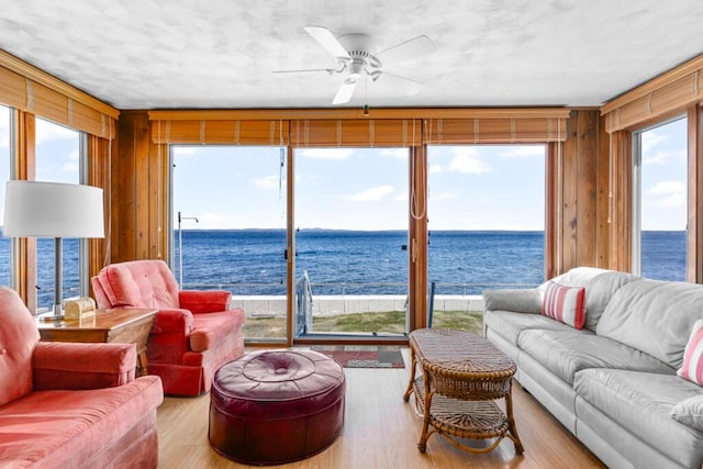 73 Wards Cove Rd, Standish, ME 04084 - sunroom featuring a water view, wood finished floors, and plenty of natural light