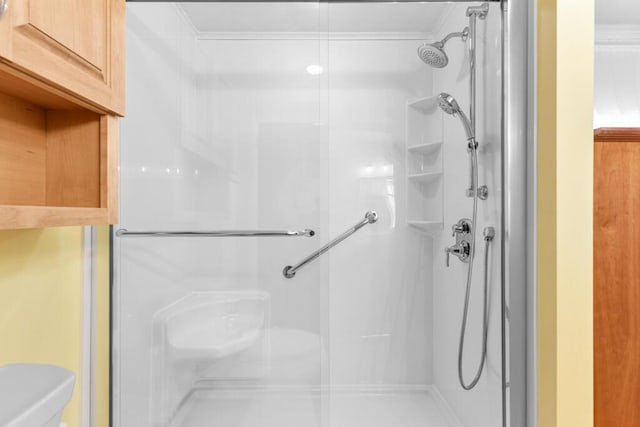 73 Wards Cove Rd, Standish, ME 04084 - bathroom with a shower stall, toilet, and ornamental molding