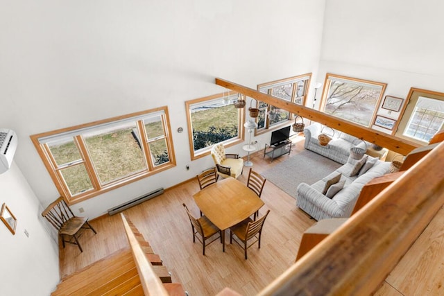 73 Wards Cove Rd, Standish, ME 04084 - living room featuring a high ceiling, wood finished floors, healthy amount of natural light, and a baseboard heating unit