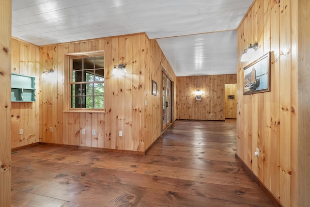 389 Castle Island Rd, Belgrade, ME 04917 - hallway featuring wooden walls, hardwood / wood-style flooring, and baseboards