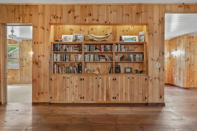389 Castle Island Rd, Belgrade, ME 04917 - detailed view of wood walls, wood finished floors, and baseboards