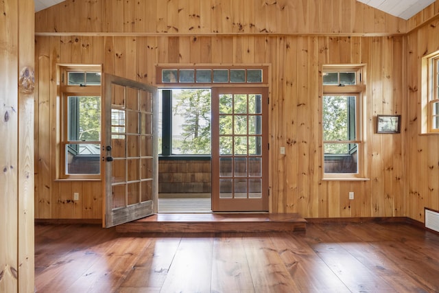 389 Castle Island Rd, Belgrade, ME 04917 - entryway with vaulted ceiling, french doors, hardwood / wood-style floors, and wooden walls