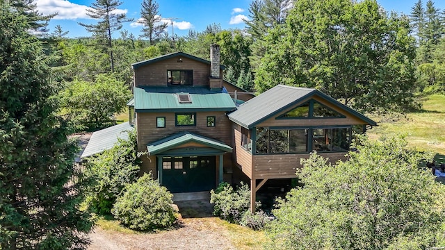 890 Salem Rd, Freeman Twp, ME 04983 - rustic home with a sunroom and a chimney