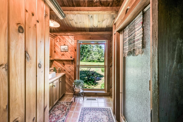 890 Salem Rd, Freeman Twp, ME 04983 - doorway featuring wood ceiling, tile patterned floors, and wood walls