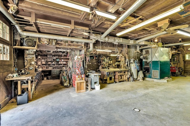 890 Salem Rd, Freeman Twp, ME 04983 - below grade area with a workshop area and heating unit