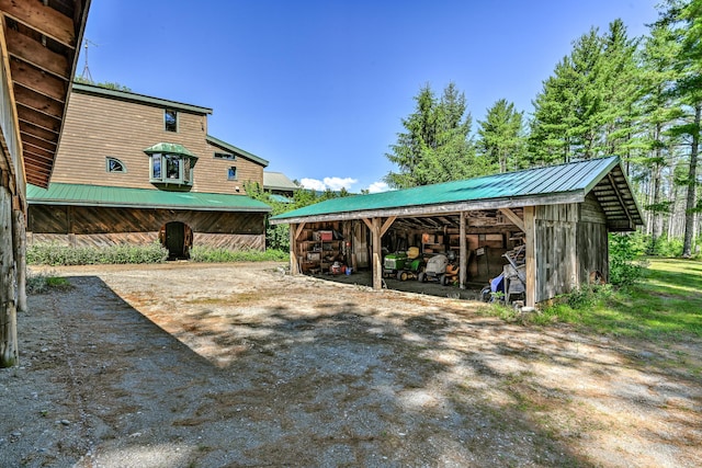 890 Salem Rd, Freeman Twp, ME 04983 - view of patio featuring a pole building and an outdoor structure