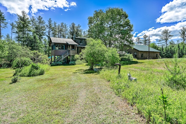 890 Salem Rd, Freeman Twp, ME 04983 - view of grassy yard with stairs