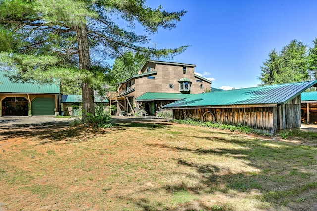 890 Salem Rd, Freeman Twp, ME 04983 - view of green lawn with a garage and an outdoor structure