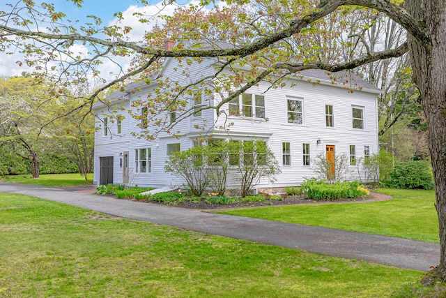 288 Foreside Rd, Falmouth, ME 04105 - view of front of property with a front yard and a chimney