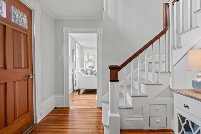 288 Foreside Rd, Falmouth, ME 04105 - entryway with hardwood / wood-style flooring, stairs, and crown molding