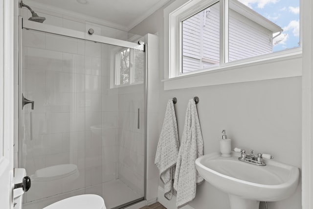 288 Foreside Rd, Falmouth, ME 04105 - bathroom with ornamental molding, a stall shower, and toilet