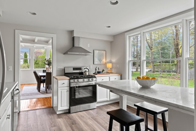 288 Foreside Rd, Falmouth, ME 04105 - kitchen featuring stainless steel appliances, wall chimney exhaust hood, white cabinetry, plenty of natural light, and recessed lighting