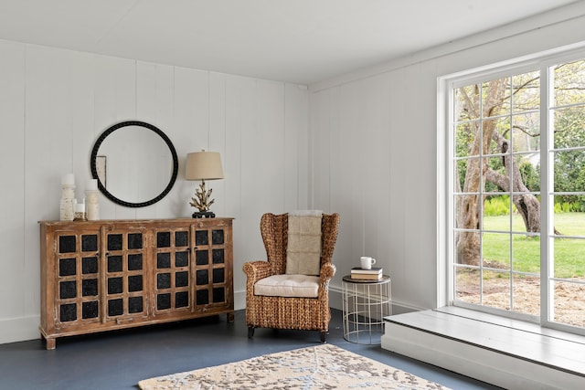 288 Foreside Rd, Falmouth, ME 04105 - living area with finished concrete flooring and a decorative wall