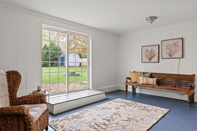 288 Foreside Rd, Falmouth, ME 04105 - living room featuring concrete floors and a decorative wall