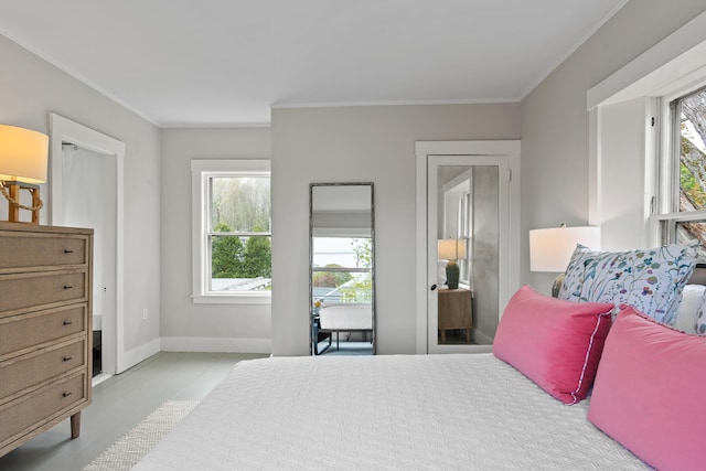 288 Foreside Rd, Falmouth, ME 04105 - bedroom with multiple windows, crown molding, and baseboards