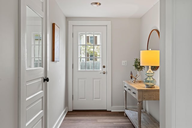 288 Foreside Rd, Falmouth, ME 04105 - doorway featuring wood finished floors and baseboards