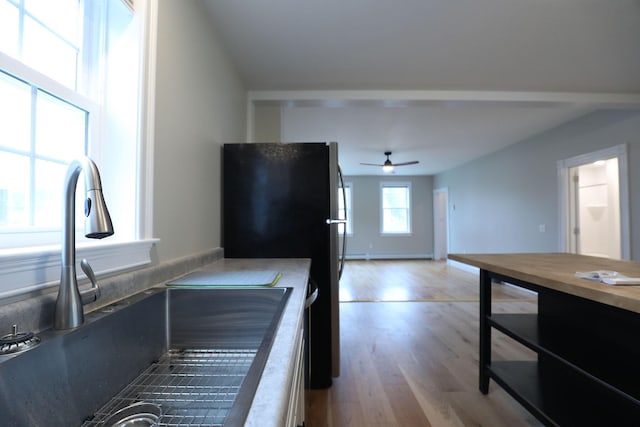 7 Middle St, Hallowell, ME 04347 - kitchen featuring a sink, ceiling fan, wood finished floors, freestanding refrigerator, and wooden counters