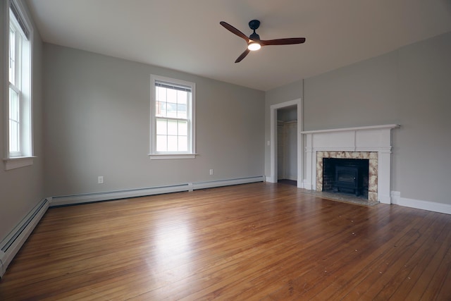 7 Middle St, Hallowell, ME 04347 - unfurnished living room featuring a baseboard radiator, ceiling fan, wood finished floors, and baseboard heating