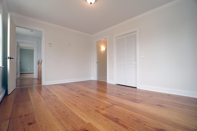 7 Middle St, Hallowell, ME 04347 - empty room featuring light wood-style flooring, ornamental molding, and baseboards