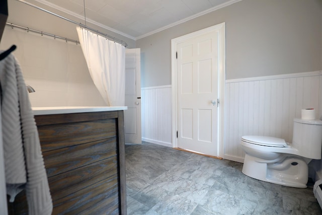 7 Middle St, Hallowell, ME 04347 - full bath featuring ornamental molding, toilet, a wainscoted wall, marble look tile flooring, and a shower with curtain