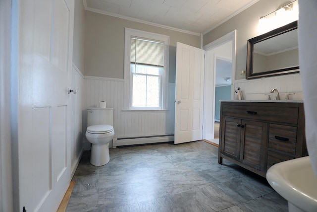 7 Middle St, Hallowell, ME 04347 - bathroom featuring baseboard heating, wainscoting, crown molding, toilet, and vanity