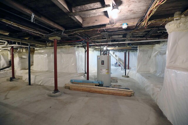 7 Middle St, Hallowell, ME 04347 - unfinished basement with water heater and stairway