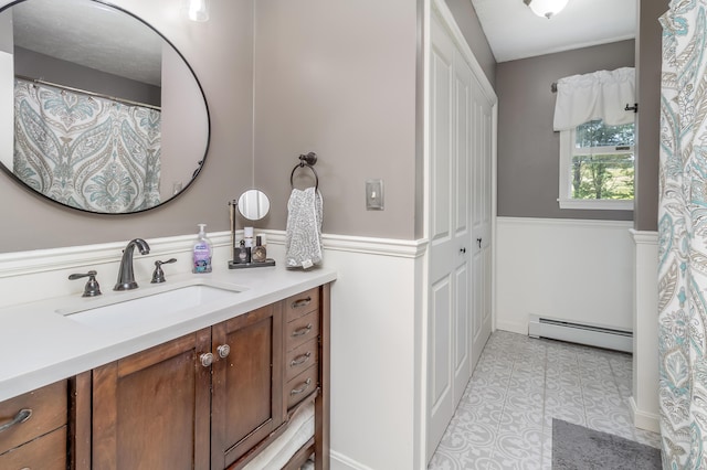 320 Grove St, Lewiston, ME 04240 - full bathroom with a baseboard heating unit, vanity, and tile patterned floors