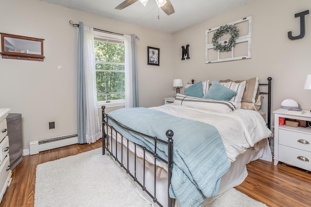 320 Grove St, Lewiston, ME 04240 - bedroom featuring a baseboard heating unit, wood finished floors, and ceiling fan