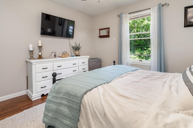 320 Grove St, Lewiston, ME 04240 - bedroom featuring dark wood-style floors and baseboards