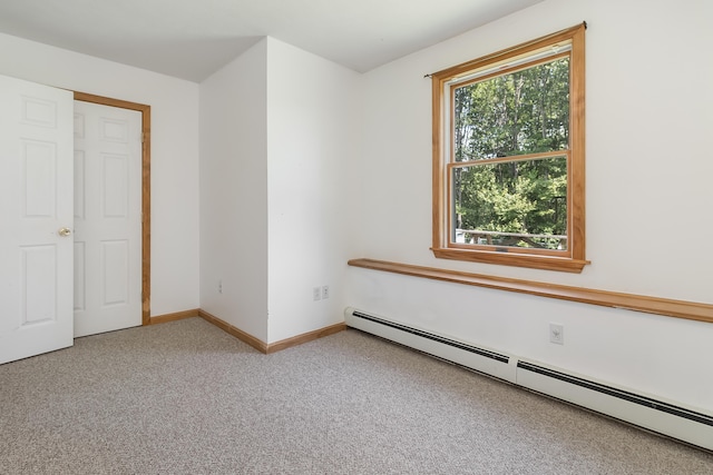 320 Grove St, Lewiston, ME 04240 - unfurnished bedroom with a baseboard heating unit and carpet flooring