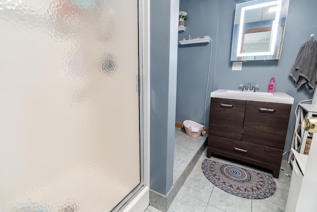 320 Grove St, Lewiston, ME 04240 - full bath with a stall shower, tile patterned flooring, and vanity