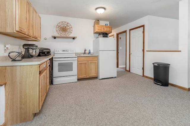 320 Grove St, Lewiston, ME 04240 - kitchen featuring white appliances, light countertops, and light carpet