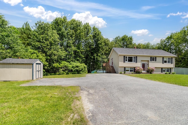 320 Grove St, Lewiston, ME 04240 - split foyer home with a storage shed and a front lawn