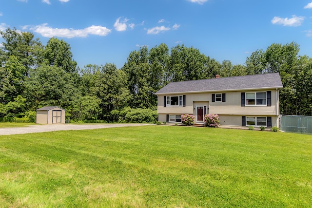 320 Grove St, Lewiston, ME 04240 - raised ranch with a storage shed and a chimney