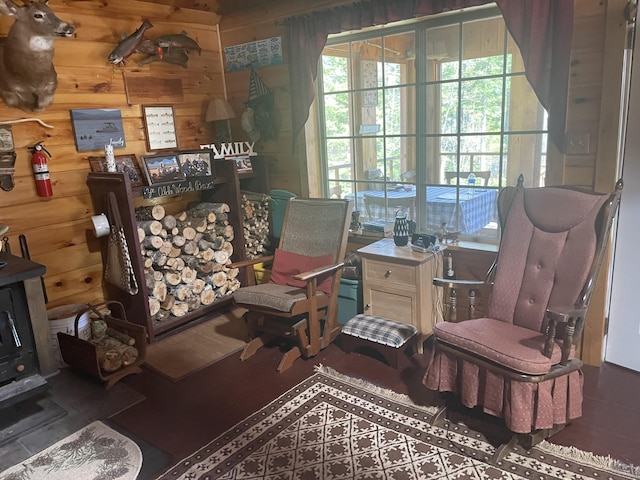 living area featuring wood walls