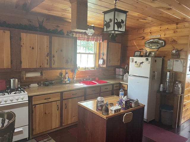 kitchen featuring white appliances, light countertops, a sink, wood ceiling, and a center island