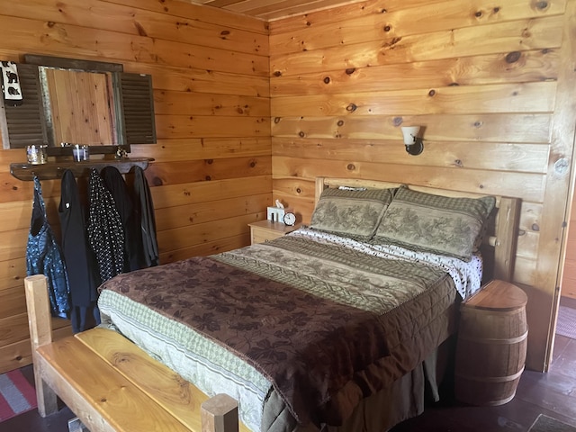 bedroom with wooden walls