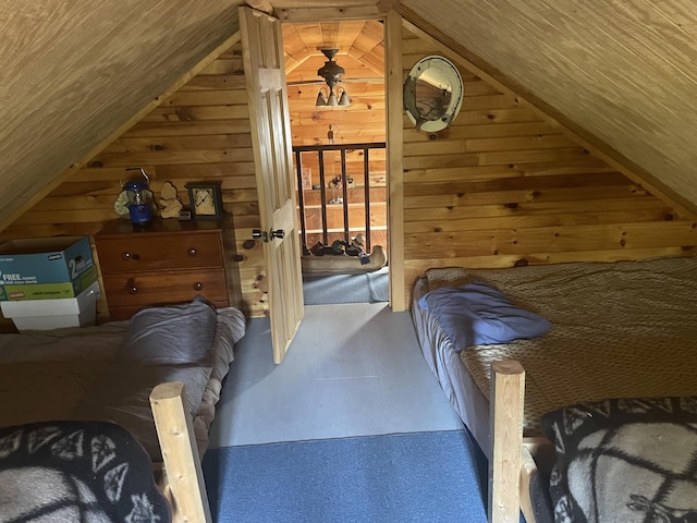 bedroom featuring wood walls, vaulted ceiling, wooden ceiling, and access to outside