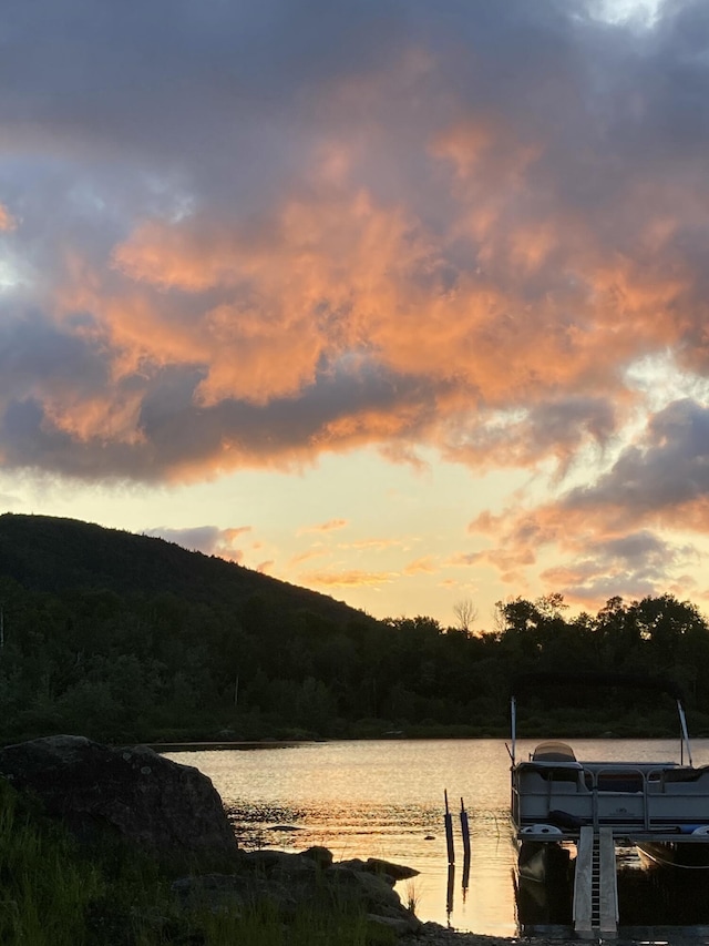 LotTS None, Attean Twp, ME 04945 - water view with a dock and a mountainous background