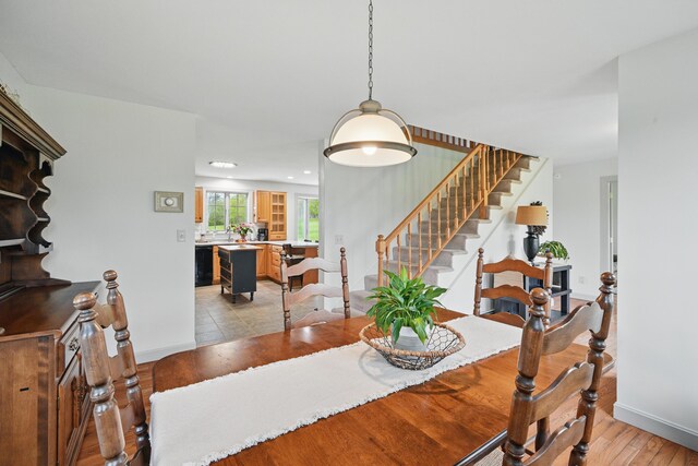 94 Staples Hill Rd, Canton, ME 04221 - dining space with light wood-type flooring, baseboards, stairs, and recessed lighting
