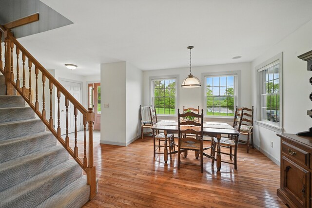 94 Staples Hill Rd, Canton, ME 04221 - dining room featuring light wood finished floors, stairs, and baseboards