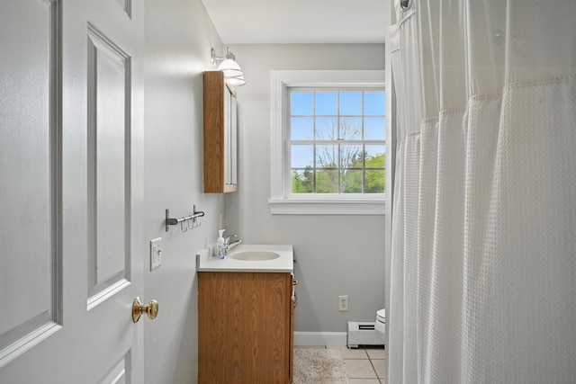 94 Staples Hill Rd, Canton, ME 04221 - bathroom featuring tile patterned flooring, vanity, toilet, baseboard heating, and baseboards