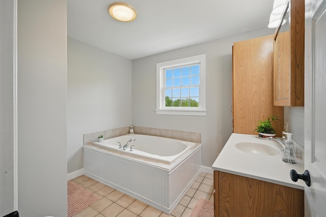94 Staples Hill Rd, Canton, ME 04221 - full bath featuring vanity, tile patterned flooring, a garden tub, and baseboards