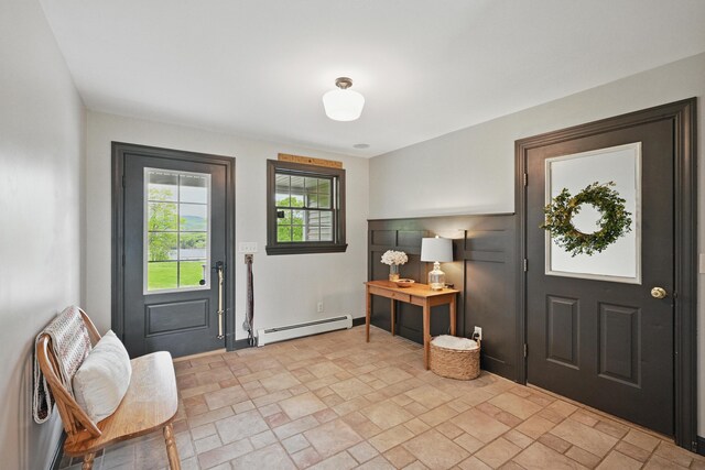 94 Staples Hill Rd, Canton, ME 04221 - entrance foyer with baseboard heating and light stone finish floors